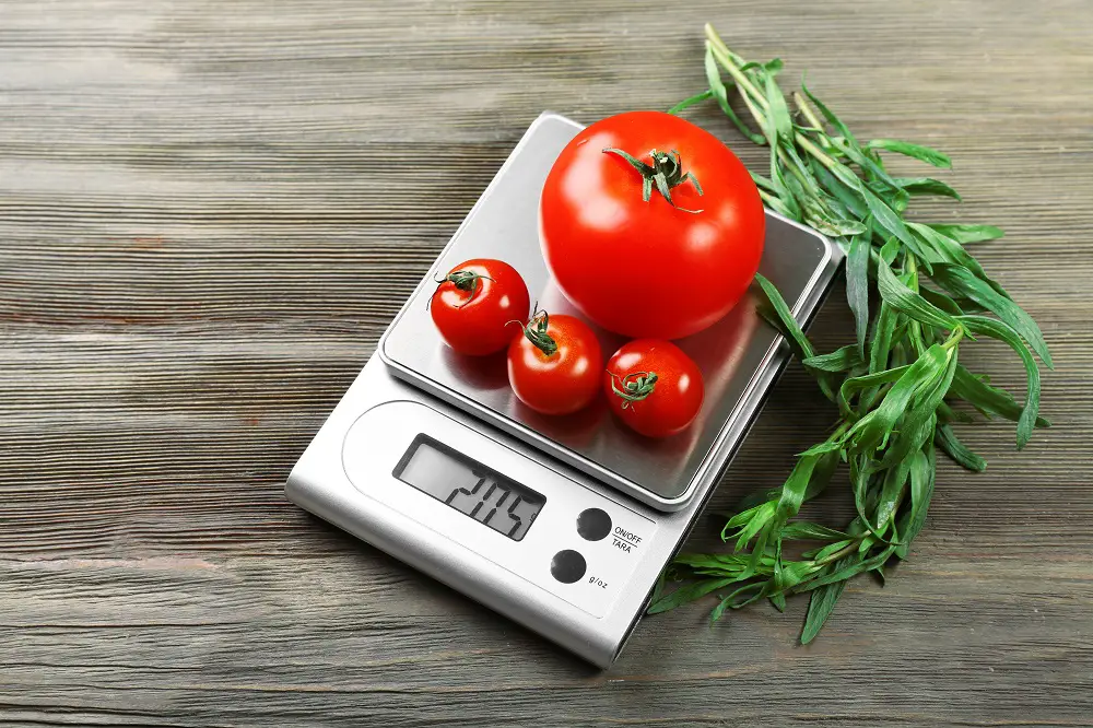 Tomatoes on digital kitchen scales